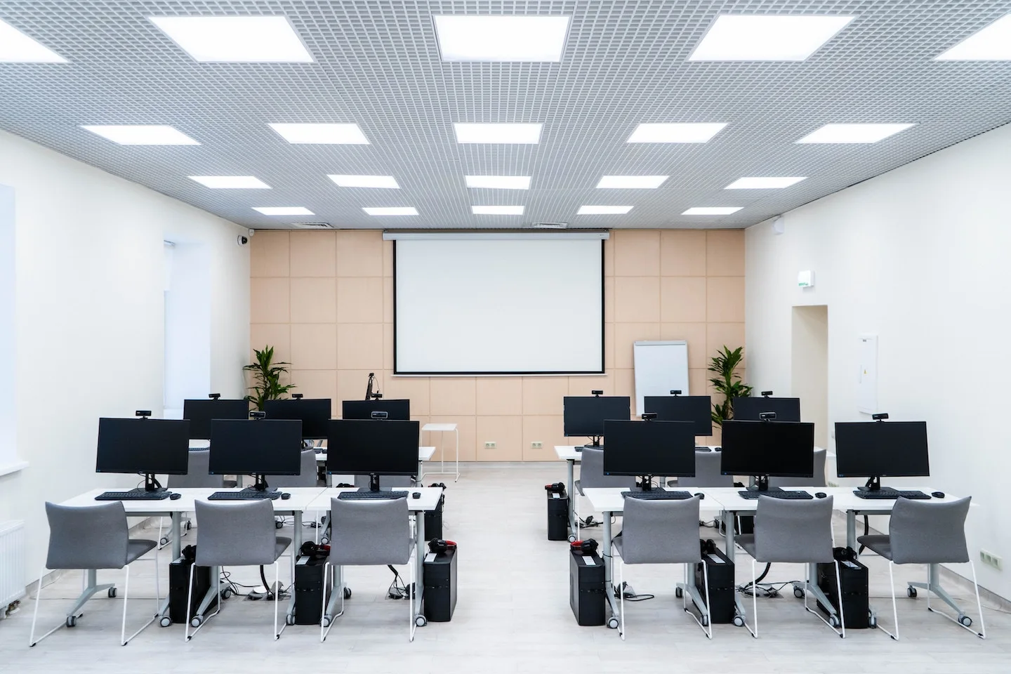 Lecture room with overhead lighting fixture installations.