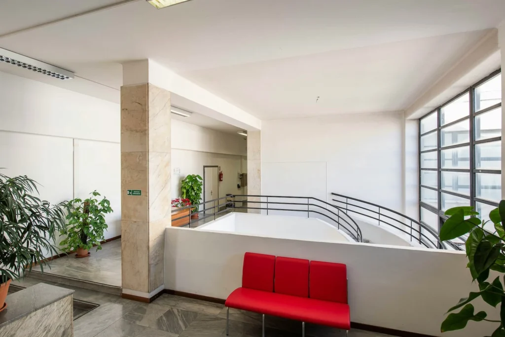 Stairwell and sitting area inside commercial building space.