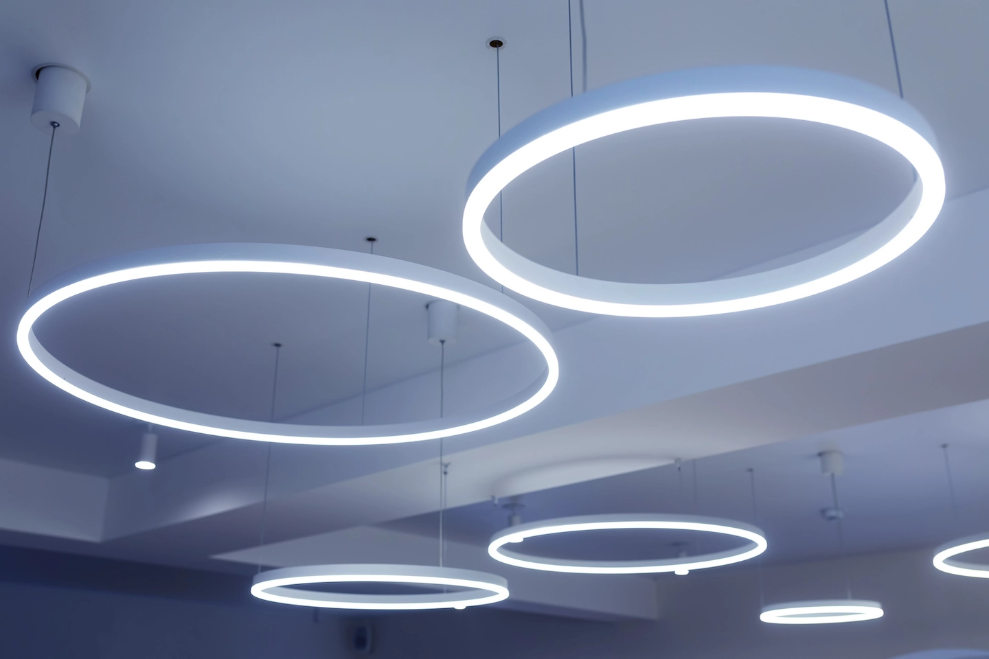 Circular LED lighting hanging from the ceiling.