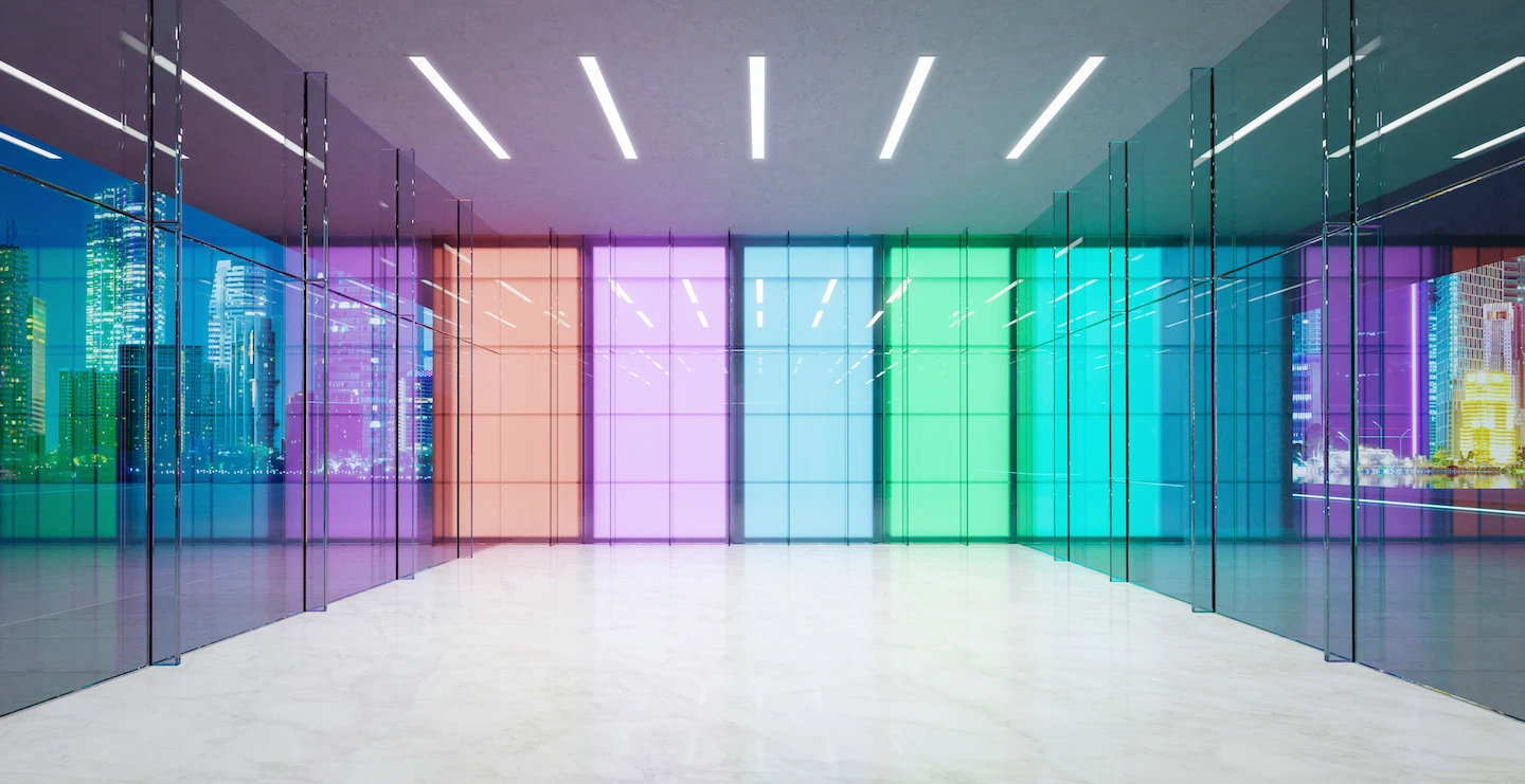 Multi-colored window panels with glass walls on either side and LED lighting on the ceiling.