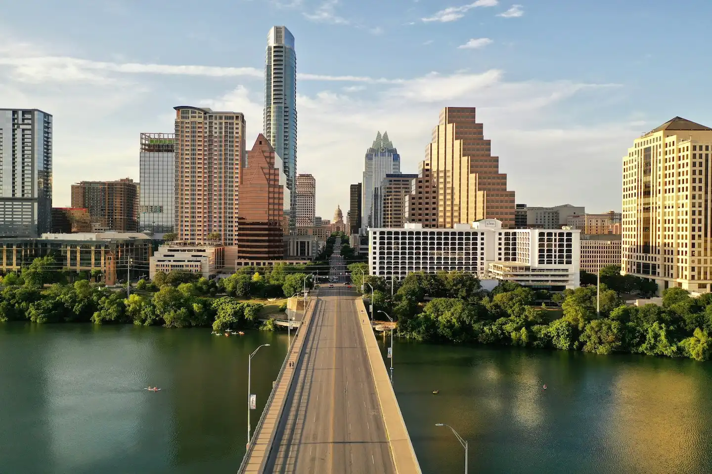 Congress bridge over Lady Bird Lake in Downtown Austin, leading to the Texas Capitol.